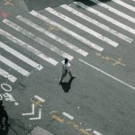 two man walking on pedestrian lane during daytime