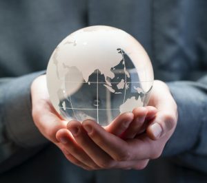 shallow focus photo of clear glass globe table ornament